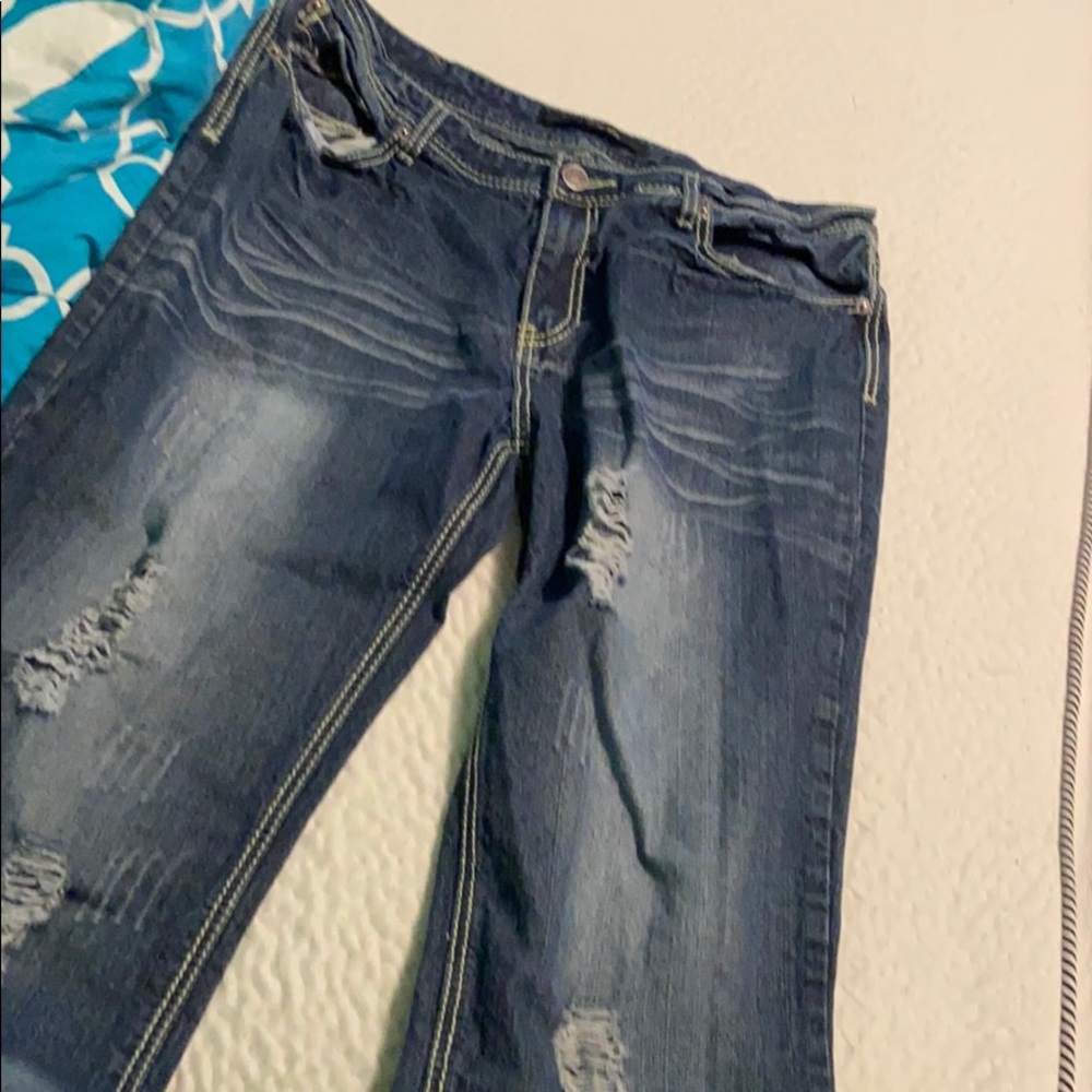 Jeans with rips by black